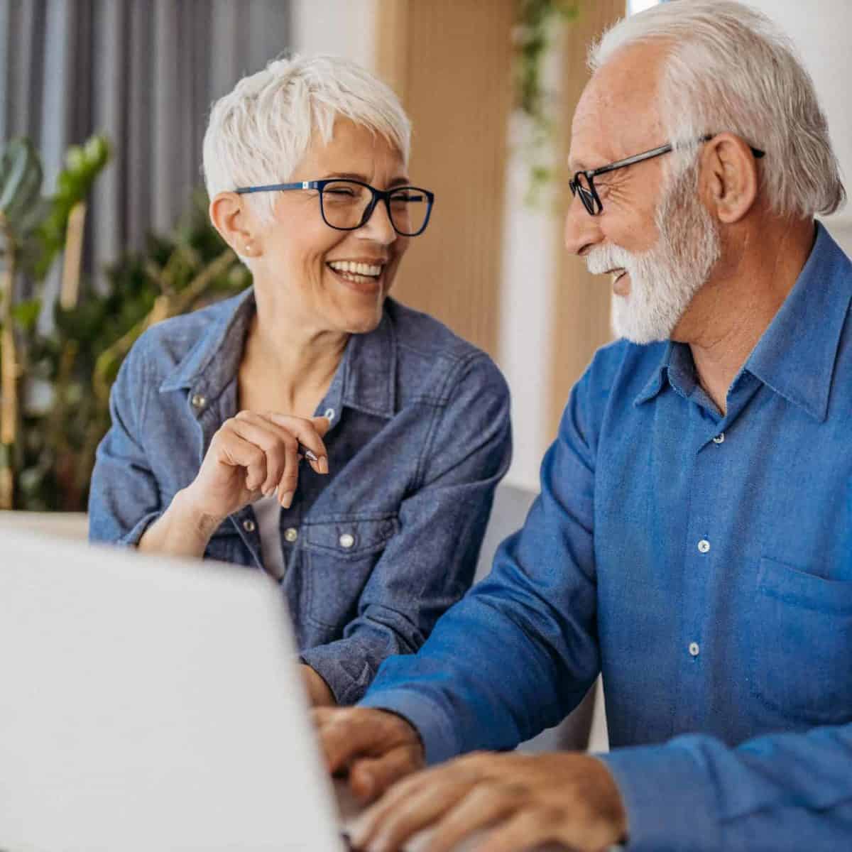 Irwinton Precious Metals IRA & Investing Company Locations Copy of Senior couple at laptop smiling GettyImages 1323096524 1200x1200 1