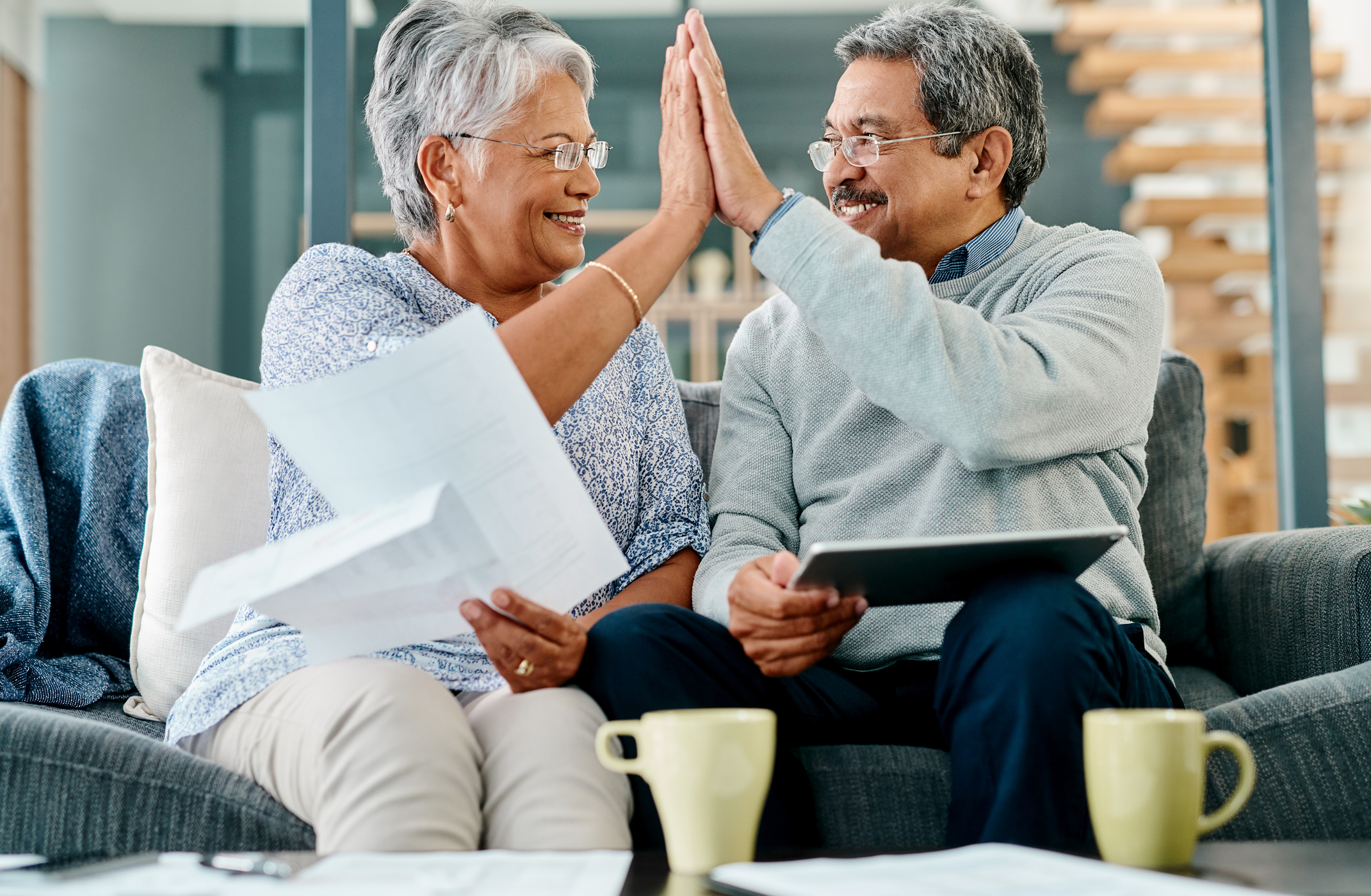Georgia Gold IRA Investing Company getty couple high five happy